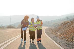 A team of engineers and workers oversees a wind turbine project at a modern wind farm, working together to ensure the efficient generation of renewable energy photo