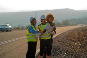 A team of engineers and workers oversees a wind turbine project at a modern wind farm, working together to ensure the efficient generation of renewable energy photo