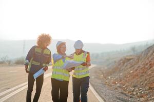 A team of engineers and workers oversees a wind turbine project at a modern wind farm, working together to ensure the efficient generation of renewable energy photo