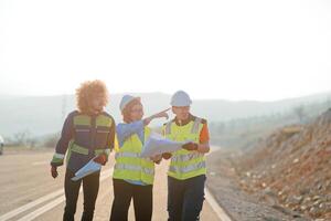A team of engineers and workers oversees a wind turbine project at a modern wind farm, working together to ensure the efficient generation of renewable energy photo