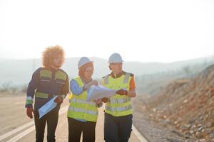 A team of engineers and workers oversees a wind turbine project at a modern wind farm, working together to ensure the efficient generation of renewable energy photo