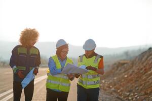 A team of engineers and workers oversees a wind turbine project at a modern wind farm, working together to ensure the efficient generation of renewable energy photo