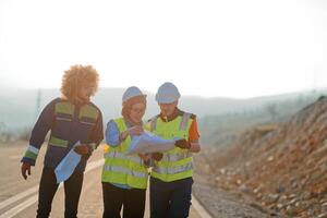 A team of engineers and workers oversees a wind turbine project at a modern wind farm, working together to ensure the efficient generation of renewable energy photo