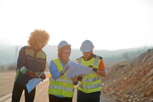 A team of engineers and workers oversees a wind turbine project at a modern wind farm, working together to ensure the efficient generation of renewable energy photo