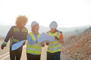 A team of engineers and workers oversees a wind turbine project at a modern wind farm, working together to ensure the efficient generation of renewable energy photo