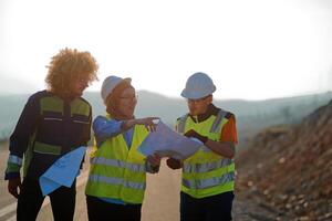 A team of engineers and workers oversees a wind turbine project at a modern wind farm, working together to ensure the efficient generation of renewable energy photo