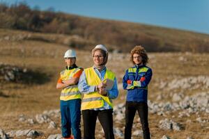 A team of engineers and workers oversees a wind turbine project at a modern wind farm, working together to ensure the efficient generation of renewable energy photo