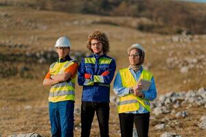 A team of engineers and workers oversees a wind turbine project at a modern wind farm, working together to ensure the efficient generation of renewable energy photo