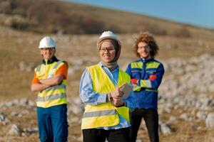 A team of engineers and workers oversees a wind turbine project at a modern wind farm, working together to ensure the efficient generation of renewable energy photo