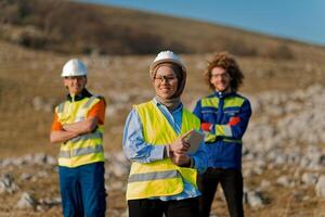 A team of engineers and workers oversees a wind turbine project at a modern wind farm, working together to ensure the efficient generation of renewable energy photo