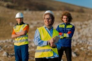 A team of engineers and workers oversees a wind turbine project at a modern wind farm, working together to ensure the efficient generation of renewable energy photo