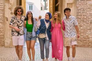 A diverse group of tourists, dressed in summer attire, strolls through the tourist city with wide smiles, enjoying their sightseeing adventure photo