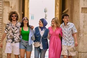 A diverse group of tourists, dressed in summer attire, strolls through the tourist city with wide smiles, enjoying their sightseeing adventure photo