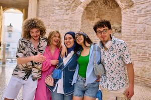 A diverse group of tourists, dressed in summer attire, strolls through the tourist city with wide smiles, enjoying their sightseeing adventure photo