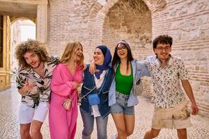 A diverse group of tourists, dressed in summer attire, strolls through the tourist city with wide smiles, enjoying their sightseeing adventure photo