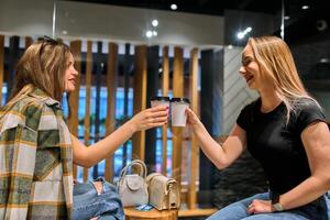 Catching Up and Caffeinating. Two Friends Unwind After a Long Day with Coffee and Conversation photo