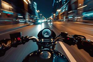 A motorcycle is speeding down a road with a splash of water behind it photo
