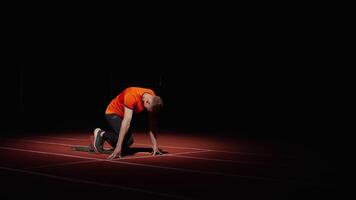 Sprinter Preparing To Start, Athletic Man Standing On Starting Blocks In Sprint Lane, Slow Motion video