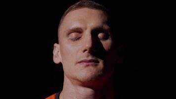 Portrait Of Worried Sprinter Before Running Race, Closeup View Of Face In Darkness, Man Looking Up video