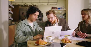 Business Owner, Web Developer And Marketing Specialists Meeting In Cafeteria For Discussing Projects video