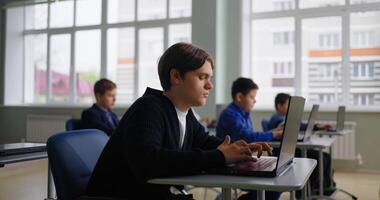 Diverse School Students Boys Working With Laptops In Computer-Based Class, Web-Design In School video