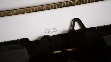 Typing the word UNABLE with a old manual typewriter video