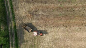 Top View Of Tractor Fertilizing Farm Field. video
