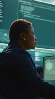 Vertical Cyber security expert working on encryption and IT security in a governmental agency. Woman engaging on cyber operations, network security and data protection for hybrid war. Camera B. video