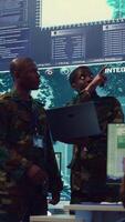 Vertical Signal support systems specialists work with battlefield data and terminal devices in military command post. Reconnaissance operators targeting enemy warships on CCTV radar. Camera B. video