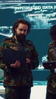 Vertical Officers team managing air traffic control for military aircrafts within the operational area, using CCTV radar surveillance. Evaluating and presenting mission plans to their crew. Camera A. video