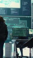 Vertical Governmental hackers team securing computer systems from cyber threats, working together in agency control room. Emphasizing encryption, online security and espionage against cyber attacks. Camera B. video