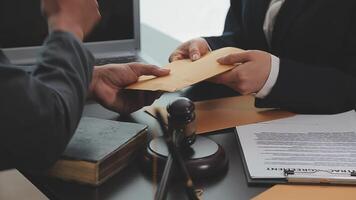 Judge gavel with Justice lawyers having team meeting at law firm background. Concepts of Law and Legal services. video