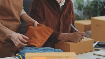 couple start up small business owner are thrilled with their success in online sales and e-commerce. video