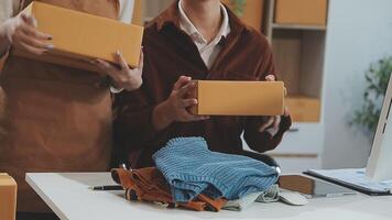 couple start up small business owner are thrilled with their success in online sales and e-commerce. video