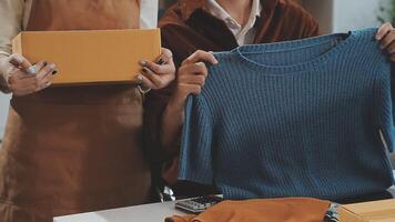 couple start up small business owner are thrilled with their success in online sales and e-commerce. video