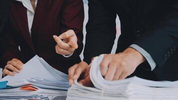 Group of casually dressed asian businesspeople discussing ideas in the office. Creative professionals gathered at the meeting table for discuss important issues of the new successful startup project video