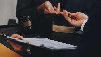 Judge gavel with Justice lawyers having team meeting at law firm background. Concepts of Law and Legal services. video
