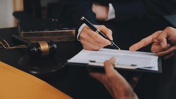 Judge gavel with Justice lawyers having team meeting at law firm background. Concepts of Law and Legal services. video