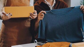 couple start up small business owner are thrilled with their success in online sales and e-commerce. video