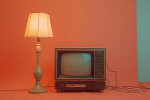 A television is sitting on a stand next to a lamp photo