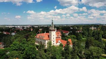 Aerial view of chateau Pruhonice with tower and pond in Czechia in June 2024 video