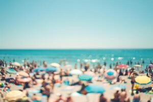 A beach scene with many people and umbrellas photo