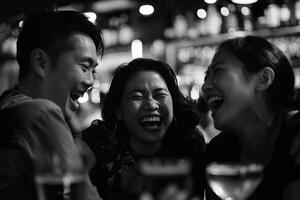 Asian adults laughing and drinking having fun at a party in a bar photo
