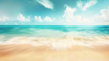 Abstract blur defocused background. Tropical summer beach with golden sand, turquoise ocean and blue sky with white clouds on bright sunny day. Colorful landscape for summer holidays photo