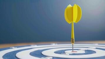 A yellow dart is perfectly centered in the bullseye of a dartboard photo