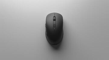 Image of a sleek, black mouse placed centrally on a minimalist grey surface. The design emphasizes simplicity and functionality, appealing to modern aesthetics. photo