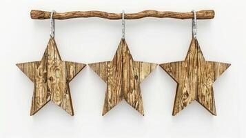 Three wooden stars hang from a branch, a rustic and simple decoration photo