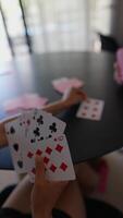 Playing a fun card game with family at home on a sunny afternoon, full of laughter and relaxation video