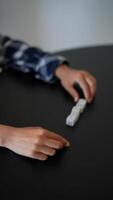 Board game with hands, dice, and dominoes for casual fun and social interaction on a tabletop video
