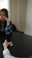 Group socializing and playing at a table, possibly with dominoes, connecting with each other video